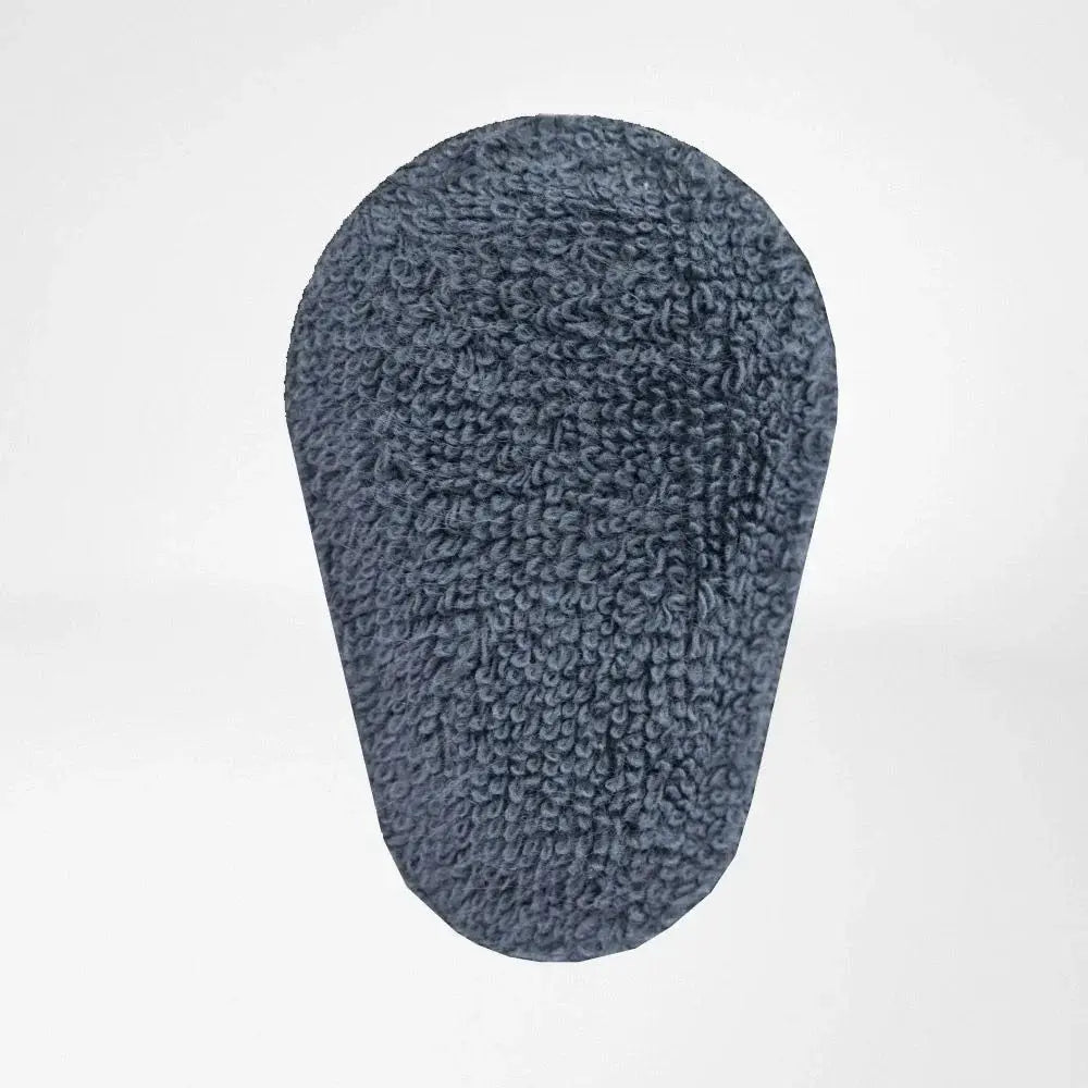 Close-up of plush dark gray brace pad with textured surface