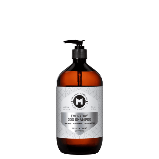 Everyday dog shampoo bottle with black pump, amber bottle, gray front label