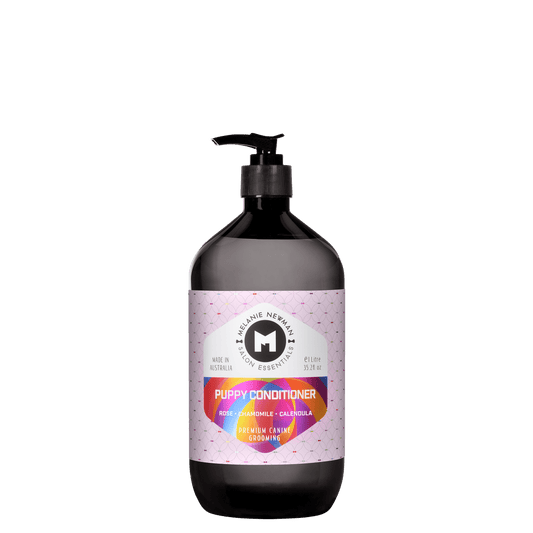 Melanie Newman Puppy Conditioner bottle with black pump, dark bottle and purple label