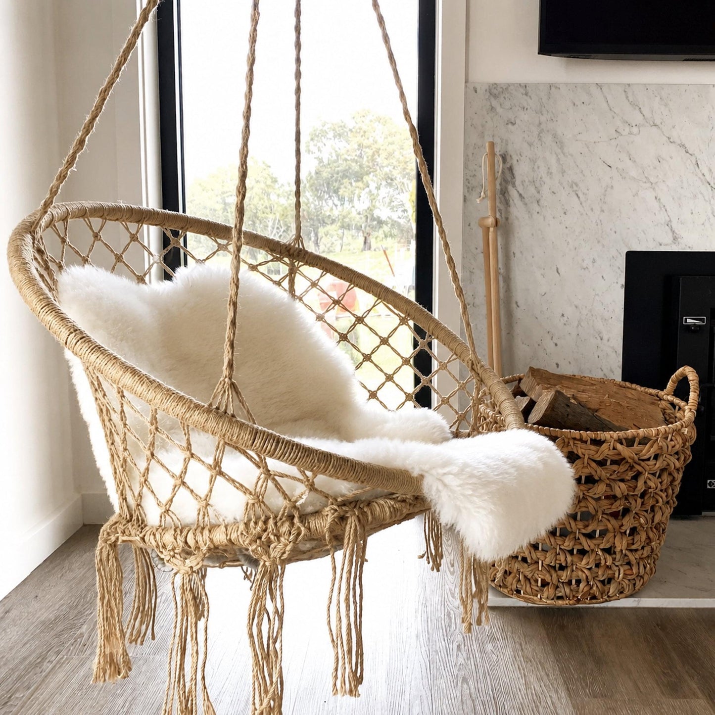 Natural macrame hanging chair swing with cushioned seat and diamond-pattern netting