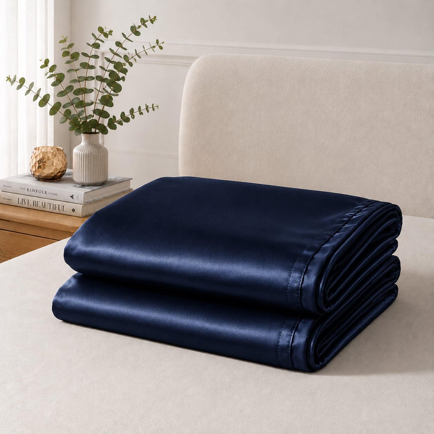 Folded navy satin pillowcase set, smooth fabric with hemmed edges