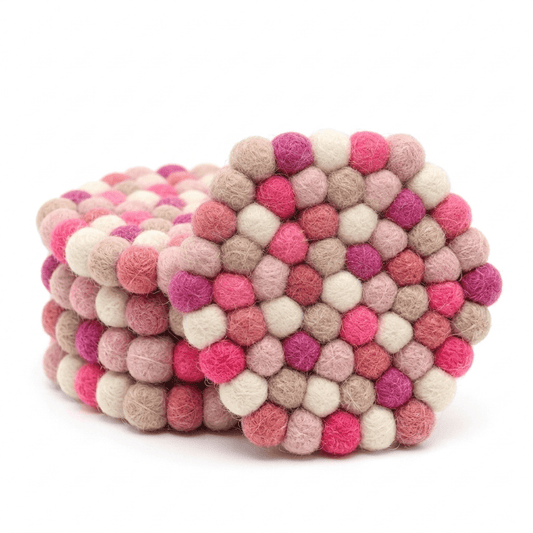 Round wool felt coaster, berry pink, cream, and tan felt-ball pattern