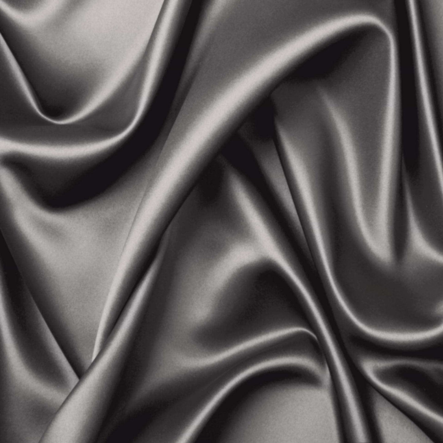 Charcoal bamboo sheet fabric close-up with smooth, silky sheen and folds