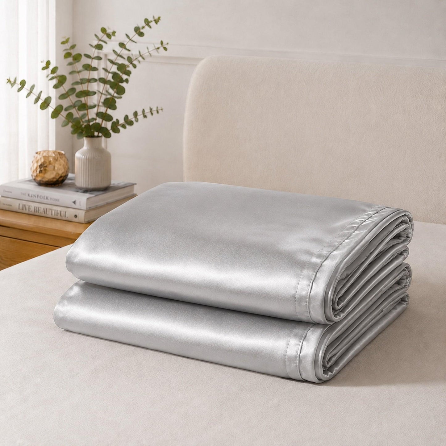 Silver satin pillowcase set, neatly folded stack