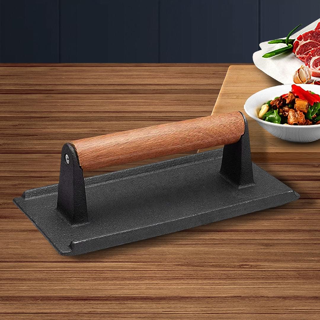 Cast iron bacon press grill weight with wooden handle and flat black base