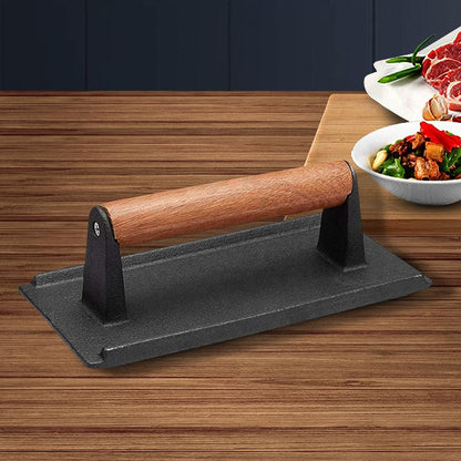 Cast iron bacon press grill weight with wooden handle and flat black base