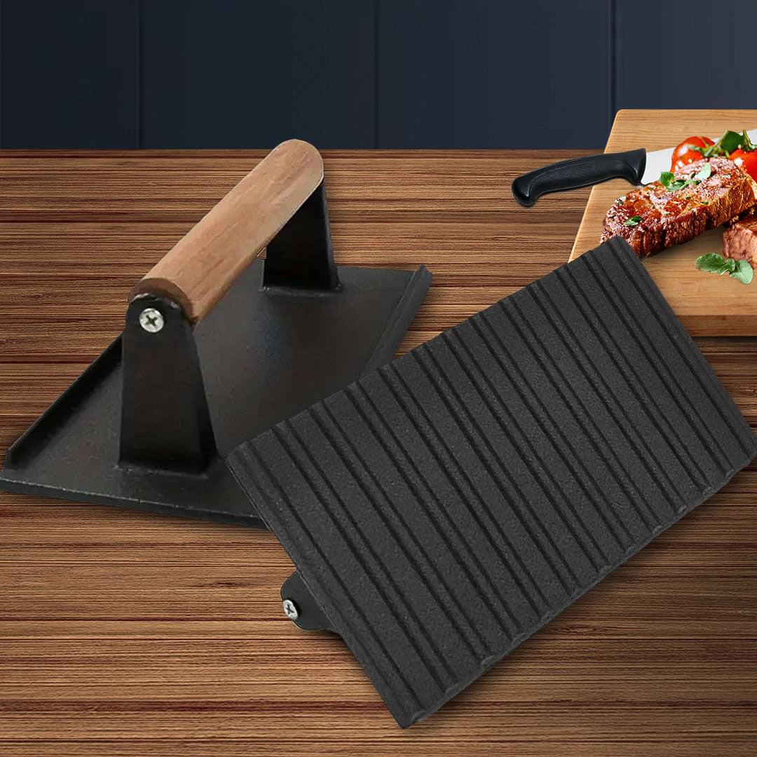 Cast iron bacon press with wooden handle, ribbed plate, and black frame
