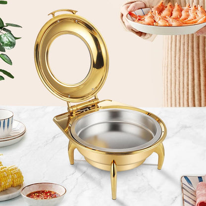 Gold-plated chafing dish with open lid and stainless insert pan on legs