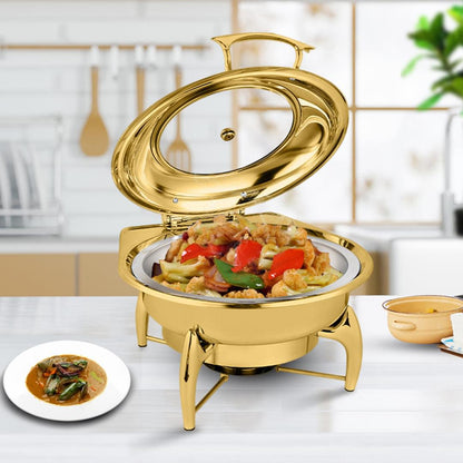 Gold-plated round chafing dish with open lid, holding prepared food