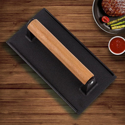 Cast iron bacon press weight plate with wooden handle bar and ridged surface
