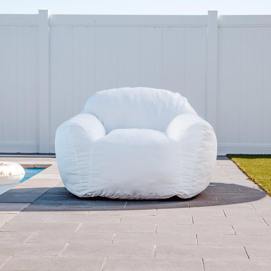 White Outdoor DreamPod bean bag chair, rounded back and molded armrests.