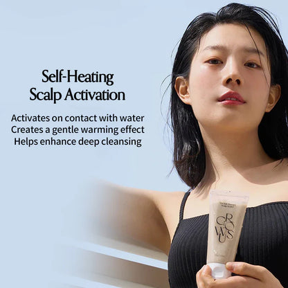 Self-heating scalp scrub tube held by woman with short dark hair