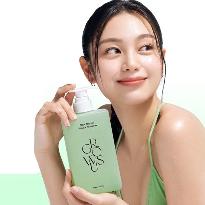 Mineral shampoo bottle with white pump held by person in a green tank top.