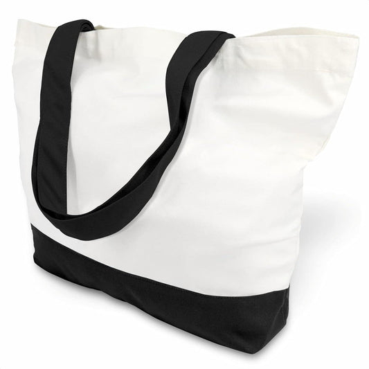 Two-tone cotton canvas tote bag: white body, black bottom, black shoulder straps.