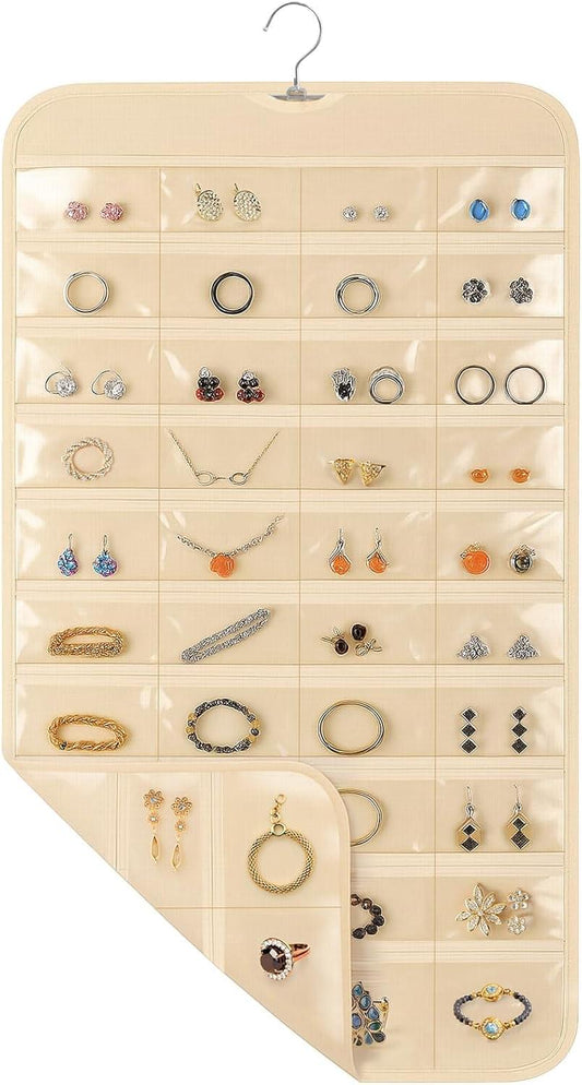 Beige hanging jewelry organizer with clear pocket rows for rings and earrings