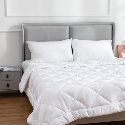 White cotton-covered pillow pair on bed, plush poly-filled cushions