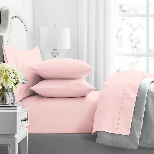 Pink cotton sheet set with two matching pillowcases and fitted sheet