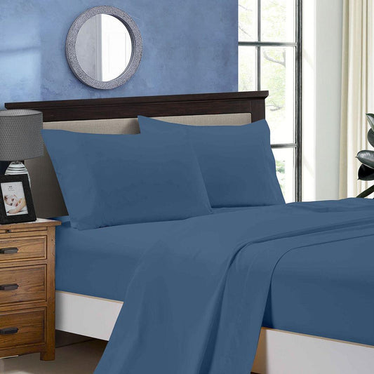 King sheet set in greyish blue with fitted sheet and flat sheet on a bed