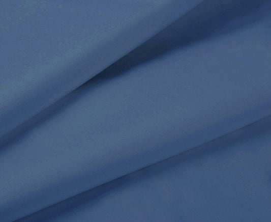 Greyish blue sheet fabric close-up with smooth finish and draped folds