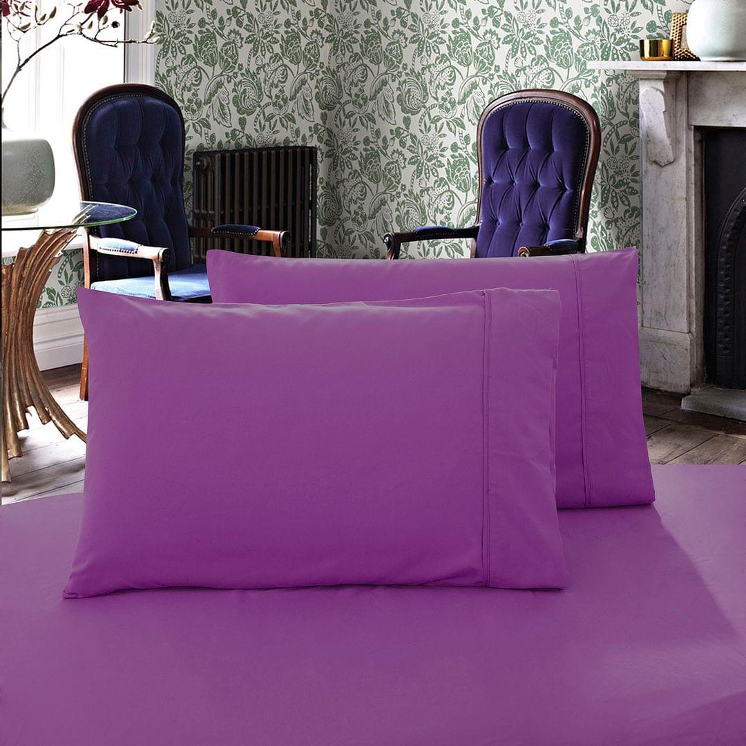 Purple king pillowcases set of 2 with smooth plain weave, folded on bed