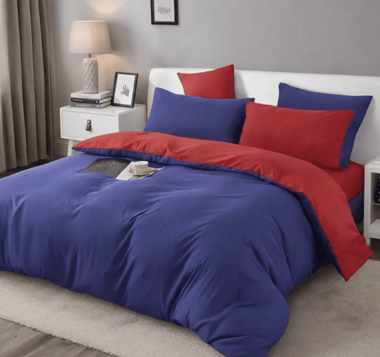 Reversible king duvet cover set with blue bedding and red pillow accents, matching pillowcases