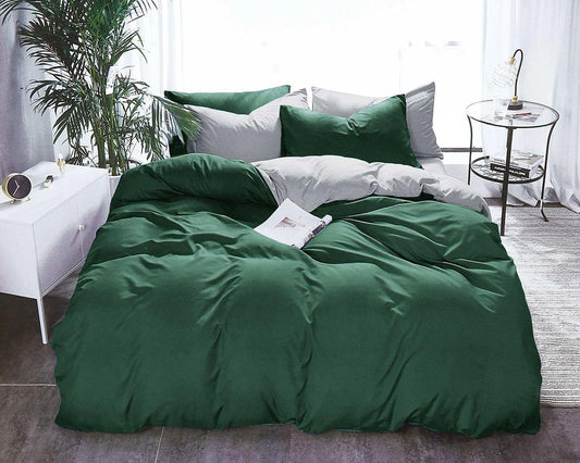 Reversible queen duvet cover set, dark green on bed with pillows