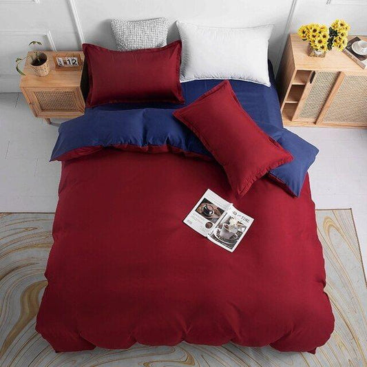 Reversible duvet cover set with red and navy blue bedding and matching square pillows