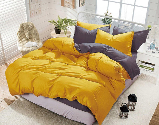 Reversible duvet quilt cover set in yellow and grey with stitched corner details