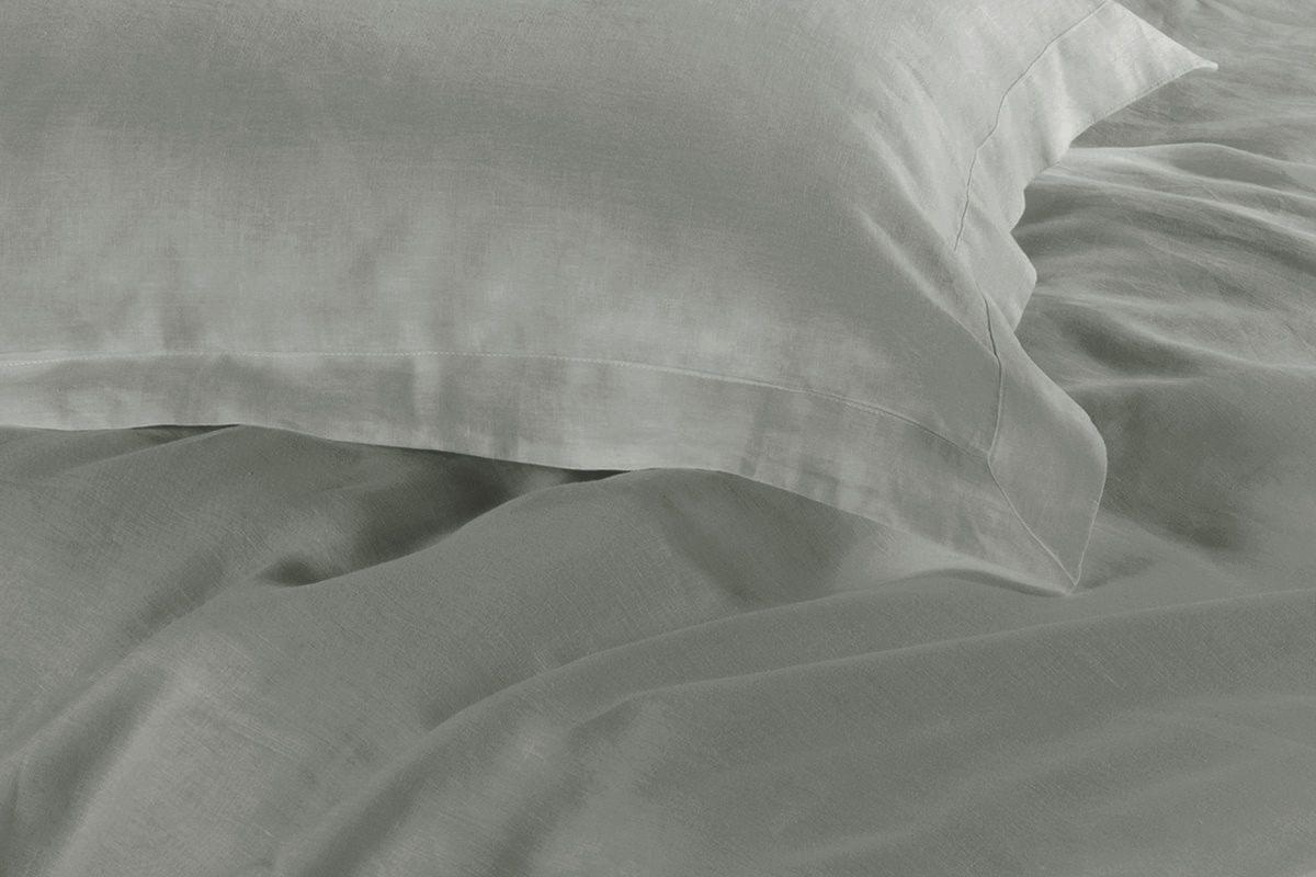 Grey duvet cover fabric close-up with smooth texture and subtle folds