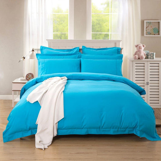Light blue duvet quilt cover set in single bed arrangement with pillowcases