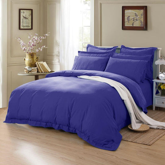 Royal blue duvet cover set with matching pillowcases, shown on a bed
