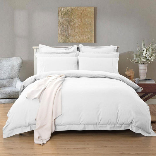 White single duvet quilt cover set with matching pillowcases, neatly tailored