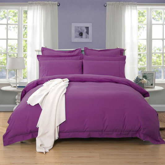 Purple duvet cover and pillowcases set with neatly arranged bedding