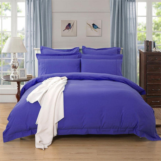 Royal blue duvet cover set with pillow shams, styled on a bed