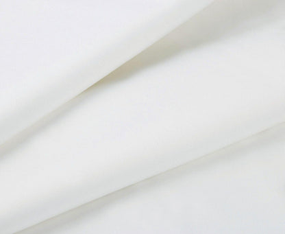 White flat bed sheet with smooth, wrinkle-free fabric close-up