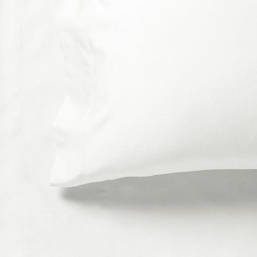 White fitted bed sheet edge with stitched seam and gathered fabric