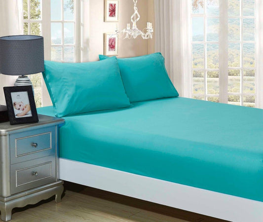 Teal fitted sheet and two matching pillowcases on a bed