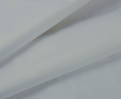 Silver sheet fabric close-up with smooth surface and soft folds