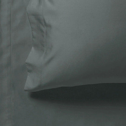Charcoal fitted sheet edge close-up with stitched seam and smooth fabric