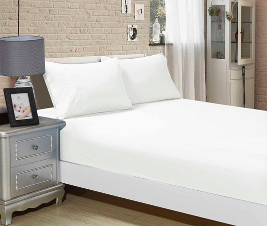 White fitted sheet and pillowcases on king single bed