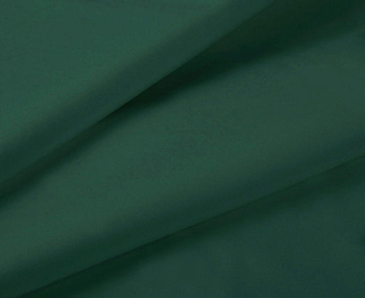 Dark green fitted sheet fabric close-up with smooth drape