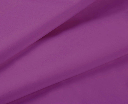 Purple sheet fabric close-up with smooth wrinkles and draped folds