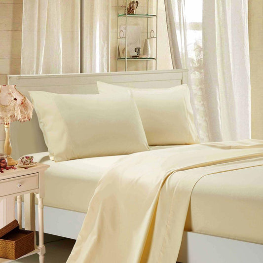 Cream bed sheet set with flat sheet, fitted sheet, and matching pillowcases