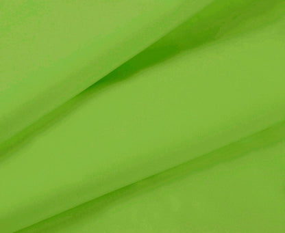 Green bed sheet fabric close-up with subtle weave texture