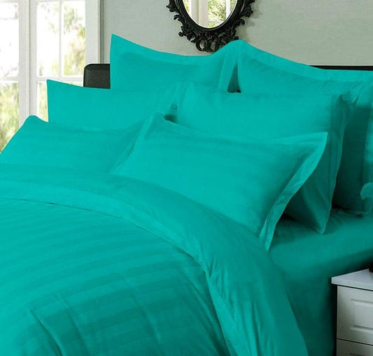 Teal striped duvet quilt cover with pillowcase, folded close-up