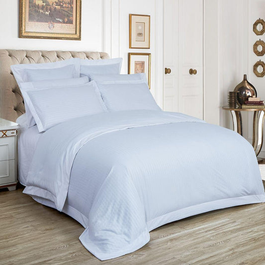 White striped duvet cover set with pillow shams, queen size, on bed