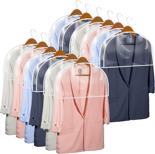Transparent garment bags on hangers in pastel and dark colors