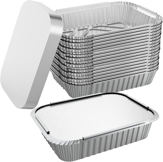 Stacked aluminum foil food containers with lids, one open for serving