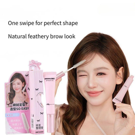 Pink edge control wax stick with brush applicator for shaping hair edges