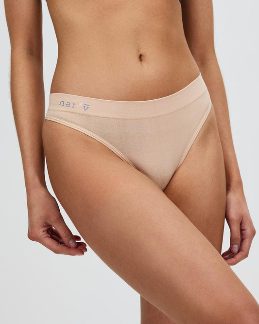 Bone-beige sheer thong g-string with thin sides and low rise
